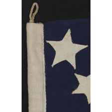 37 STARS IN A MEDALLION CONFIGURATION ON AN ANTIQUE AMERICAN FLAG OF THE 1867-1876 PERIOD, IN A RARE AND DESIRABLE SMALL SIZE, NEBRASKA STATEHOOD