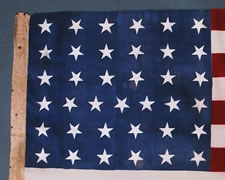 37 STARS, SILK WITH LINEN SLEEVE, TUMBLING STARS, NEBRASKA STATEHOOD, 1867-76