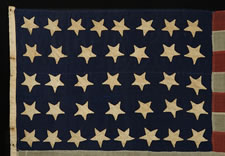 37 UPSIDE-DOWN STARS, ENTIRELY HAND-SEWN, NEBRASKA STATEHOOD, 1867-1876, THE ERA OF AMERICAN RECONSTRUCTION