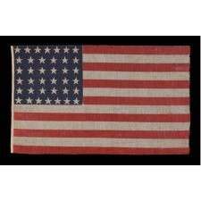 38 STAR ANTIQUE AMERICAN FLAG, MADE DURING THE PERIOD WHEN COLORADO WAS THE MOST RECENT STATE TO JOIN THE UNION, 1876-1889, WITH PENCILED INSCRIPTION FROM THE YOUNG PEOPLE'S SOCIETY OF CHRISTIAN ENDEAVOR (YPSCE), EX-RICHARD PIERCE COLLECTION OF AMERICAN FLAGS, ILLUSTRATED IN HIS BOOK "THE STARS & THE STRIPES"