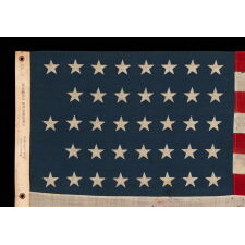 38 STAR ANTIQUE AMERICAN FLAG WITH A NOTCHED CONFIGURATION, MADE BY THE U.S. BUNTING COMPANY IN LOWELL, MASSACHUSETTS, REFLECTS THE ERA OF COLORADO STATEHOOD, circa 1876-1889