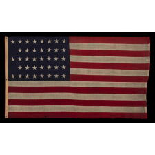 38 STAR ANTIQUE AMERICAN FLAG WITH A NOTCHED CONFIGURATION, MADE BY THE U.S. BUNTING COMPANY IN LOWELL, MASSACHUSETTS, REFLECTS THE ERA OF COLORADO STATEHOOD, circa 1876-1889