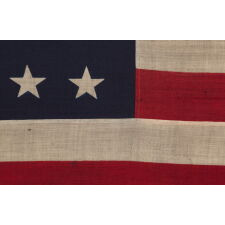 38 STAR ANTIQUE AMERICAN FLAG WITH A NOTCHED CONFIGURATION, MADE BY THE U.S. BUNTING COMPANY IN LOWELL, MASSACHUSETTS, REFLECTS THE ERA OF COLORADO STATEHOOD, circa 1876-1889