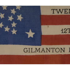 38 STAR ANTIQUE AMERICAN FLAG WITH A RARE AND BEAUTIFUL VARIATION OF THE "GREAT STAR" OR "GREAT LUMINARY" PATTERN, AN EXAMPLE OF EXTRAORDINARY QUALITY, MADE BY R.W. MUSGROVE IN BRISTOL, NEW HAMPSHIRE FOR AN 1885 REUNION OF THE 12th NH VOLUNTEERS