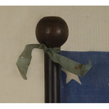 38 STAR ANTIQUE AMERICAN FLAG WITH A RARE AND BEAUTIFUL VARIATION OF THE "GREAT STAR" OR "GREAT LUMINARY" PATTERN, AN EXAMPLE OF EXTRAORDINARY QUALITY, MADE BY R.W. MUSGROVE IN BRISTOL, NEW HAMPSHIRE FOR AN 1885 REUNION OF THE 12th NH VOLUNTEERS