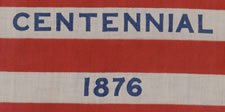 38 STAR ANTIQUE FLAG WITH "1876 CENTENNIAL" ADVERTISING & GOLD STARS, MADE FOR THE PHILADELPHIA CENTENNIAL INTERNATIONAL EXPOSITION