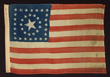 38 STAR FLAG WITH A VERY RARE CIRCLE-IN-A-SQUARE MEDALLION, SOLD BY HORSTMANN BROS. OF PHILADELPHIA, MADE FOR THE 1876 CENTENNIAL CELEBRATION