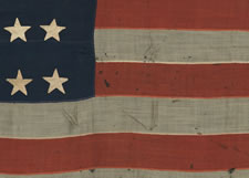 38 STARS IN A NOTCHED CONFIGURATION, ENTIRELY HAND-SEWN, MADE BY WILLIAM J. POWELL IN NEW YORK CITY BETWEEN 1881 AND 1885, (COLORADO STATEHOOD)