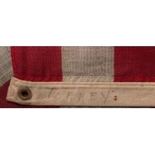 38 STARS IN A NOTCHED, CROSSHATCH PATTERN ON AN ANTIQUE AMERICAN FLAG MADE BY THE U.S. BUNTING COMPANY IN LOWELL, MASSACHUSETTS, SIGNED "TORREY," REFLECTS THE ERA OF COLORADO STATEHOOD, CIRCA 1876-1889