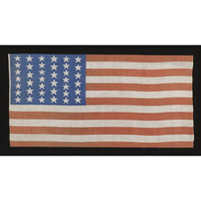 39 STAR ANTIQUE AMERICAN FLAG WITH AN ELONGATED FORMAT AND TWO SIZES OF STARS IN ALTERNATING COLUMNS, NEVER AN OFFICIAL STAR COUNT, 1876