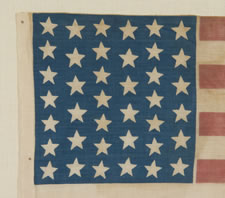 39 STARS IN TWO SIZES, ALTERNATING FROM ONE COLUMN TO THE NEXT, NEVER AN OFFICIAL STAR COUNT, 1875-76