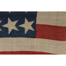 40 CANTED STARS IN AN ORDERLY PHALANX, ON AN ANTIQUE AMERICAN FLAG WITH A RARE STAR COUNT, ACCURATE FOR JUST SIX DAYS AND NEVER OFFICIAL, REFLECTING SOUTH DAKOTA’S ADMISSION TO THE UNION