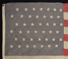 42 HAND-SEWN STARS ON A DUSTY BLUE CANTON, AN UNOFFICIAL STAR COUNT, WASHINGTON STATEHOOD, 1889-1890