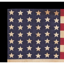 42 STARS ON AN ANTIQUE AMERICAN FLAG WITH A WAVE CONFIGURATION OF LINEAL COLUMNS, AN UNOFFICIAL STAR COUNT THAT REFLECTS THE ADDITION OF WASHINGTON STATE, MONTANA, AND THE DAKOTAS, circa 1889-1890