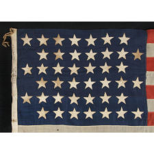 42 STARS ARRANGED IN A RARE VARIATION OF A NOTCHED DESIGN, WITH SPACES FOR 3 MORE STARS ON BOTH THE HOIST AND FLY ENDS, AN UNOFFICIAL STAR COUNT, WASHINGTON STATEHOOD, 1889-1890, SIGNED "J. & F.A. WAGNER, MAKER," CLEVELAND, OHIO