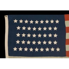 42 STARS IN AN HOURGLASS PATTERN ON AN ANTIQUE AMERICAN FLAG, AN UNOFFICIAL STAR COUNT, WASHINGTON STATEHOOD, 1889-90