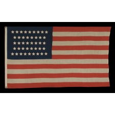 42 STARS IN AN HOURGLASS PATTERN ON AN ANTIQUE AMERICAN FLAG, AN UNOFFICIAL STAR COUNT, WASHINGTON STATEHOOD, 1889-90