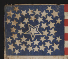 42 STARS IN A MEDALLION CONFIGURATION WITH A LARGE, HALOED CENTER STAR AND A TRIO OF 3 STARS IN EACH CORNER, EXCEPTIONALLY RARE, 1889-1890, WASHINGTON STATEHOOD