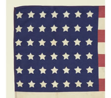 42 STARS, AN UNOFFICIAL STAR COUNT, WITH A CIVIL WAR VETERANS' OVERPRINT ACCOMPANIED BY THE DATE "1890",  UNUSUALLY EARLY FOR A G.A.R. FLAG & THE ONLY KNOWN EXAMPLE IN THIS STYLE