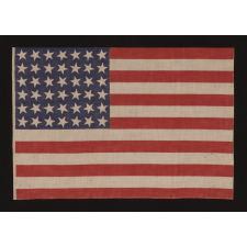 42 STARS, AN UNOFFICIAL STAR COUNT, ON AN ANTIQUE AMERICAN FLAG WITH SCATTERED STAR POSITIONING, 1889-1890, WASHINGTON STATEHOOD