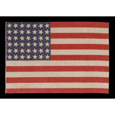 42 STARS, AN UNOFFICIAL STAR COUNT, ON AN ANTIQUE AMERICAN FLAG WITH SCATTERED STAR POSITIONING, 1889-1890, WASHINGTON STATEHOOD