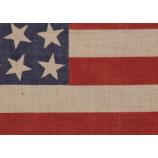 42 STARS, AN UNOFFICIAL STAR COUNT, ON AN ANTIQUE AMERICAN FLAG WITH SCATTERED STAR POSITIONING, SIGNED "MRS. G.M. GILLETTE," 1889-1890, WASHINGTON STATEHOOD