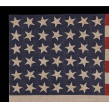 42 STARS, AN UNOFFICIAL STAR COUNT, ON AN ANTIQUE AMERICAN FLAG WITH SCATTERED STAR POSITIONING, 1889-1890, WASHINGTON STATEHOOD