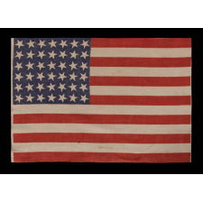 42 STARS, AN UNOFFICIAL STAR COUNT, ON AN ANTIQUE AMERICAN FLAG WITH SCATTERED STAR POSITIONING, 1889-1890, WASHINGTON STATEHOOD