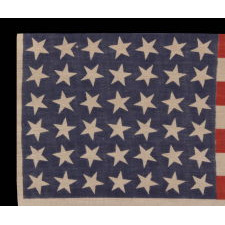 42 STARS, AN UNOFFICIAL STAR COUNT, ON AN ANTIQUE AMERICAN FLAG WITH SCATTERED STAR POSITIONING, 1889-1890, WASHINGTON STATEHOOD