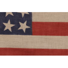 42 STARS, AN UNOFFICIAL STAR COUNT, ON AN ANTIQUE AMERICAN FLAG WITH SCATTERED STAR POSITIONING, 1889-1890, WASHINGTON STATEHOOD