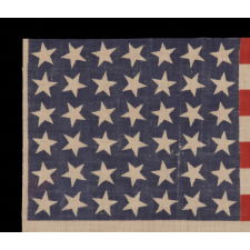 42 STARS, AN UNOFFICIAL STAR COUNT, ON AN ANTIQUE AMERICAN FLAG WITH SCATTERED STAR POSITIONING, 1889-1890, WASHINGTON STATEHOOD