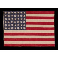 42 STARS, AN UNOFFICIAL STAR COUNT, ON AN ANTIQUE AMERICAN FLAG WITH SCATTERED STAR POSITIONING, 1889-1890, WASHINGTON STATEHOOD