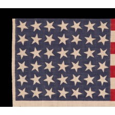 42 STARS, AN UNOFFICIAL STAR COUNT, ON AN ANTIQUE AMERICAN FLAG WITH SCATTERED STAR POSITIONING, 1889-1890, WASHINGTON STATEHOOD