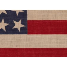 42 STARS, AN UNOFFICIAL STAR COUNT, ON AN ANTIQUE AMERICAN FLAG WITH SCATTERED STAR POSITIONING, 1889-1890, WASHINGTON STATEHOOD