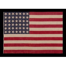 42 STARS, AN UNOFFICIAL STAR COUNT, ON AN ANTIQUE AMERICAN FLAG WITH SCATTERED STAR POSITIONING, 1889-1890, WASHINGTON STATEHOOD