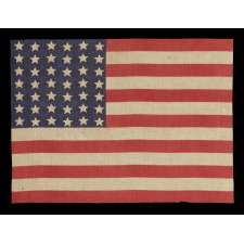 42 STARS IN A WAVE CONFIGURATION ON AN ANTIQUE AMERICAN FLAG, NEVER AN OFFICIAL STAR COUNT, 1889-1890, WASHINGTON STATEHOOD