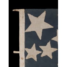 43 STAR ANTIQUE AMERICAN FLAG REFLECTING IDAHO STATEHOOD, ONE OF THE RAREST STAR COUNTS AMONG SURVIVING AMERICAN FLAGS OF THE 19TH CENTURY; A MASTERPIECE OF EARLY FLAG-MAKING WITH AN EXCEPTIONAL STARBURST MEDALLION CONFIGURATION, CIRCA 1890