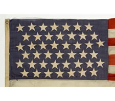 44 LARGE POINTY STARS ON A DENIM BLUE CANTON, UNUSUALLY SMALL SIZE, WYOMING STATEHOOD, 1890-1896