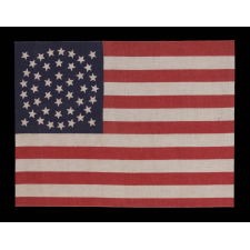 44 STAR ANTIQUE AMERICAN FLAG, MADE CIRCA 1890-1896, WHEN WYOMING WAS THE MOST RECENT STATE TO JOING THE UNION; RARE IN THIS PERIOD WITH A MEDALLION CONFIGURATION OF STARS