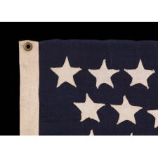 44 STAR ANTIQUE AMERICAN FLAG WITH AN HOURGLASS ARRANGEMENT ON A TWO-TONE BLUE CANTON; REFLECTS THE ERA WHEN WYOMING WAS THE MOST RECENT STATE TO JOIN THE UNION, 1890-1896