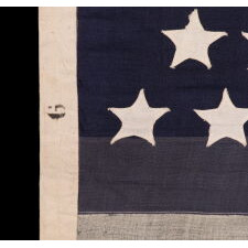 44 STAR ANTIQUE AMERICAN FLAG WITH AN HOURGLASS ARRANGEMENT ON A TWO-TONE BLUE CANTON; REFLECTS THE ERA WHEN WYOMING WAS THE MOST RECENT STATE TO JOIN THE UNION, 1890-1896