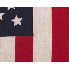 44 STAR ANTIQUE AMERICAN PARADE FLAG WITH A TRIPLE WREATH FORM OF THE MEDALLION CONFIGURATION, RARE IN THIS PERIOD WITH A CIRCULAR STAR ARRANGEMENT, 1890-1896, REFLECTS THE ADDITION OF WYOMING TO THE UNION