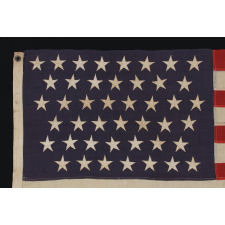 44 STARS ARRANGED IN ZIGZAGING OFFSET ROWS ON A SMALL SCALE FLAG WITH PIECED-AND-SEWN CONSTRUCTION, WYOMING STATEHOOD, 1890-1896