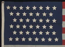 44 STARS ARRANGED IN ZIGZAGING OFFSET ROWS, MARKED "NAVY" GRADE, WYOMING STATEHOOD, 1890-1896