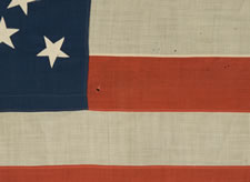 44 STARS CONFIGURED INTO THE LETTERS "U.S.", PATENTED IN 1890 BY W.R. WASHBURN, ONE OF ONLY FOUR KNOWN SURVIVING EXAMPLES AND ONE OF THE BOLDEST DESIGNS KNOWN TO EXIST IN EARLY FLAGS