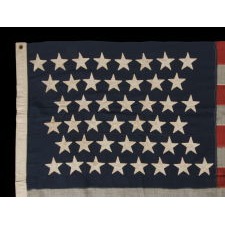 44 STARS IN ZIGZAGGING ROWS ON AN ANTIQUE AMERICAN AMERICAN FLAG MADE DURING THE LAST DECADE OF THE 19TH CENTURY, REFLECTS WYOMING STATEHOOD, 1890-1896