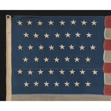 45 STARS ON AN ANTIQUE AMERICAN FLAG WITH A RICH INDIGO BLUE CANTON AND ATTRACTIVE WEAR, 1896-1907, SPANISH-AMERICAN WAR ERA, UTAH STATEHOOD