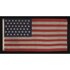 45 STARS ON AN ANTIQUE AMERICAN FLAG WITH ELONGATED PROPORTIONS AND IN A SMALL SCALE FLAG OF THE PERIOD AMONG THOSE WITH PIECED-AND-SEWN CONSTRUCTION, 1896-1908, SPANISH-AMERICAN WAR ERA, UTAH STATEHOOD