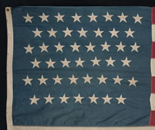 45 STARS ON AN ESPECIALLY ATTRACTIVE DENIM BLUE CANTON, A BEAUTIFUL EXAMPLE OF A COTTON BUNTING FLAG OF THIS PERIOD, 1896-1907, SPANISH-AMERICAN WAR ERA, UTAH STATEHOOD