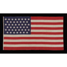 45 STARS IN LINEAR ROWS, WITH “DANCING” OR “TUMBLING” ORIENTATION, ON A LARGE SCALE PARADE FLAG WITH AN ELONGATED PROFILE, 1896-1908, SPANISH-AMERICAN WAR ERA, UTAH STATEHOOD